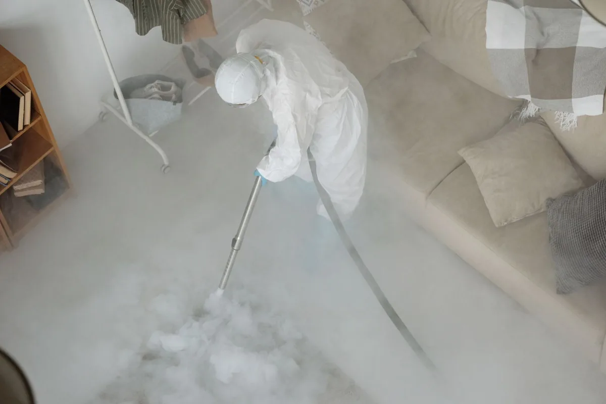 Biohazard cleanup technician in protective equipment, Emporia, KS